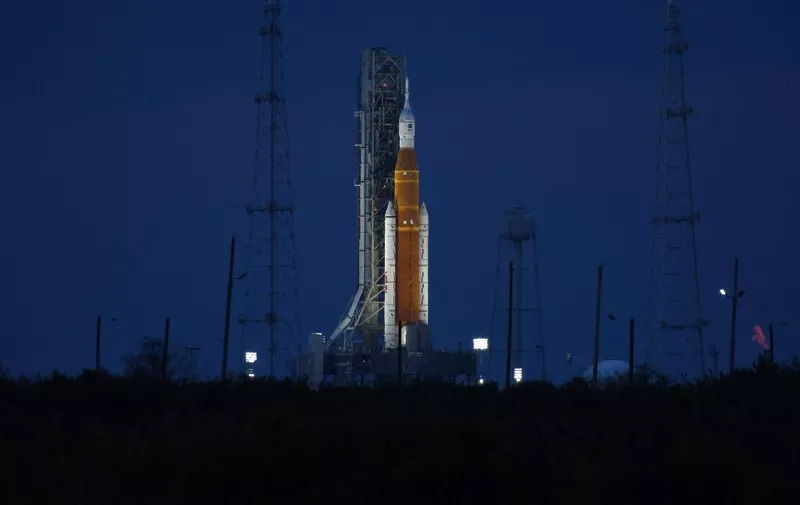 CAPE CANAVERAL, FL - NOVEMBER 15: The Artemis 1 moon rocket and the Orion spacecraft bathed in light on Launch Pad 39B November 15, 2022 as the countdown for the third launch attempt continues at the Kennedy Space Center in Cape Canaveral, Florida. NASA's Artemis 1 mission is the first test of the agency's deep space exploration systems sending the unmanned Orion spacecraft to orbit the moon several times and return back to earth.   Red Huber/Getty Images/AFP (Photo by RED HUBER / GETTY IMAGES NORTH AMERICA / Getty Images via AFP)