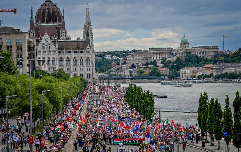 Sympathisers and members of Hungarian parties FIDESZ and KDNP (Christian Democratic Party) march in Budapest on June 01, 2024, during their Peace March, to demonstrate for the peace in Ukraine, one week before the EU election. (Photo by GERGELY BESENYEI / AFP)