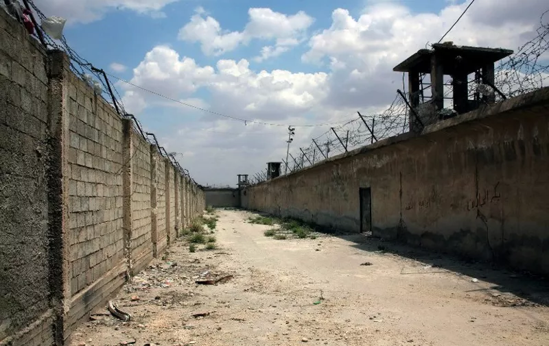 A handout picture released by the official Syrian Arab News Agency (SANA) on May 22, 2014 shows a general view of the Aleppo prison after Syria's army broke a siege of the prison, cutting off a major rebel supply route in the main northern city of Aleppo. Tanks and armoured vehicles rolled into the grounds of the prison, more than a year into a rebel siege of the sprawling complex, the Syrian Observatory for Human Rights said. AFP PHOTO / HO / SANA
== AFP PHOTO/HO/SANA == RESTRICTED TO EDITORIAL USE - MANDATORY CREDIT "AFP PHOTO / HO / SANA" - NO MARKETING NO ADVERTISING CAMPAIGNS - DISTRIBUTED AS A SERVICE TO CLIENTS === / AFP PHOTO / SANA / HO