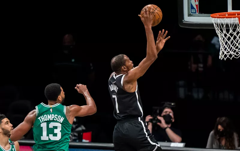 Brooklyn Nets forward Kevin Durant (7) shots in front of Boston Celtics center Tristan Thompson (13) during the first half of Game 1 of an NBA basketball first-round playoff series Saturday, May 22, 2021, in New York. (AP Photo/Corey Sipkin)