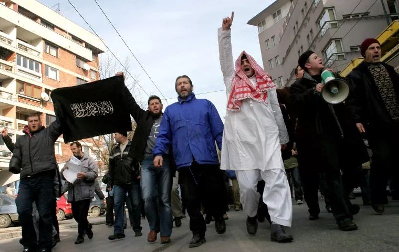 A group of approximately 3,000 radical Islamists protest in the streets of the Bosnian capital of Sarajevo, 08 February, 2006, against cartoons that appeared in some Western papers, depicting Islamic prophet Mohamed as a terrorist. Bosnian Muslims rallyed to show their support to Muslims protesting in the Eastern parts of the world. Protestors walked the city streets and stopped briefly in front of embassies of Sweden, Norway, France and Denmark. AFP PHOTO ELVIS BARUKCIC