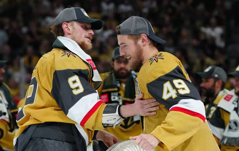 Jun 13, 2023; Las Vegas, Nevada, USA; Vegas Golden Knights forward Jack Eichel (9) hands over the Stanley Cup to forward Ivan Barbashev (49) after defeating the Florida Panthers in game five of the 2023 Stanley Cup Final at T-Mobile Arena. Mandatory Credit: Stephen R. Sylvanie-USA TODAY Sports