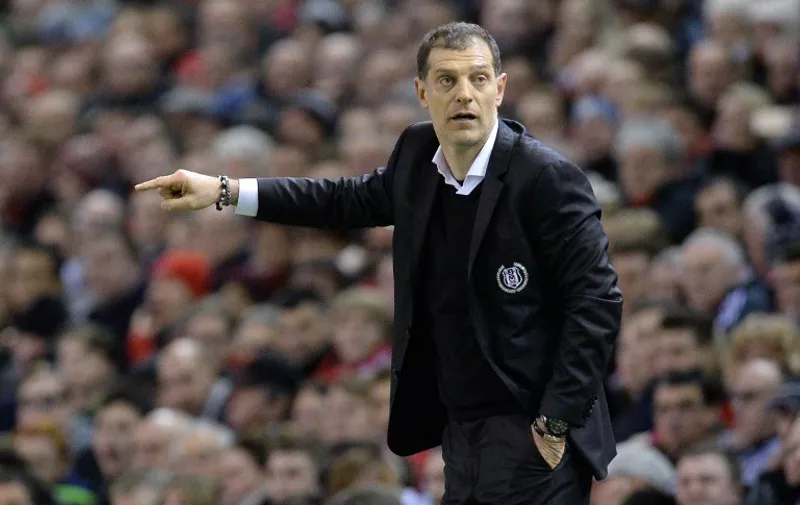 Besiktas' Croatian coach Slaven Bilic gestures from the touchline during the UEFA Europa League round of 32 first leg football match between Liverpool and Besiktas at Anfield in Liverpool, northwest England, on February 19, 2015.  AFP PHOTO / OLI SCARFF
