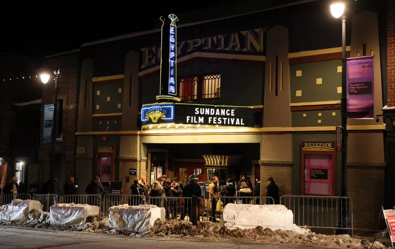 PARK CITY, UTAH - JANUARY 18: People walk past the Egyptian Theatre during the 2024 Sundance Film Festival on January 18, 2024 in Park City, Utah.   Dia Dipasupil/Getty Images/AFP (Photo by Dia Dipasupil / GETTY IMAGES NORTH AMERICA / Getty Images via AFP)