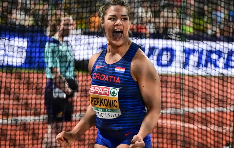 Croatia's Sandra Perkovic celebrates winning a gold in the women's Discus Throw final during the European Athletics Championships at the Olympic Stadium in Munich, southern Germany on August 16, 2022. (Photo by ANDREJ ISAKOVIC / AFP)