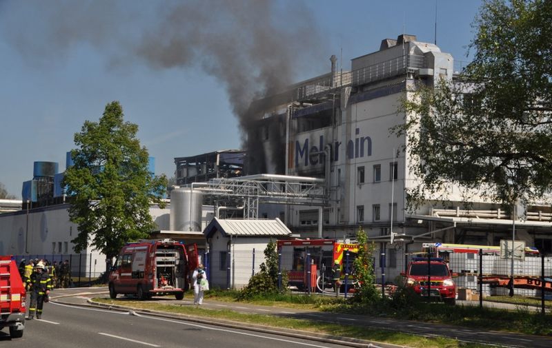 A picture taken on May 12, 2022 shows columns of black smoke billowing from the factory of resin supplier Melamin, where a cistern exploded for unknown reason, sparking a fire and killing five people. The factory is located in Kocevje municipality, some 60 kilometres (40 miles) south of Ljubljana. (Photo by Ales Kocjan / STA FOTO / AFP)