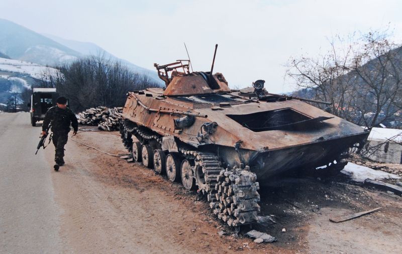 A blown up tank on the road to Mrkonjic Grad Photograph by Simon Dack 1996, Image: 98580494, License: Rights-managed, Restrictions: , Model Release: no, Credit line: Profimedia, Alamy