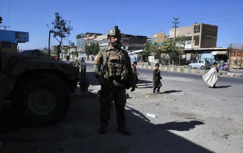 An Afghan security force personnel stands guard along the roadside in Herat on August 12, 2021, as Taliban took over the police headquarters in Herat, Afghanistan's third-largest city and also seized another key district capital just 150 kilometres (95 miles) from capital Kabul. (Photo by - / AFP)