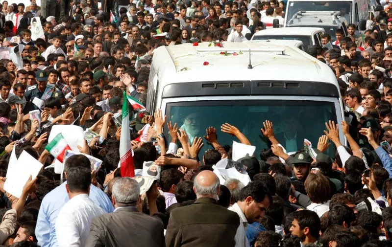 A handout picture released by the official website of Iran's Supreme Leader Ayatollah Ali Khamenei shows Iranians sorrounding his car to welcome him upon his arrival to the northeastern city of Bojnourd on October 10, 2012. khamenei said that Iran can overcome "barbaric" economic sanctions imposed by Western countries over its controversial nuclear programme. AFP PHOTO/HO/LEADER.IR == RESTRICTED TO EDITORIAL USE - MANDATORY CREDIT "AFP PHOTO/HO/LEADER.IR" - NO MARKETING NO ADVERTISING CAMPAIGNS - DISTRIBUTED AS A SERVICE TO CLIENTS  == / AFP / LEADER.IR / HO