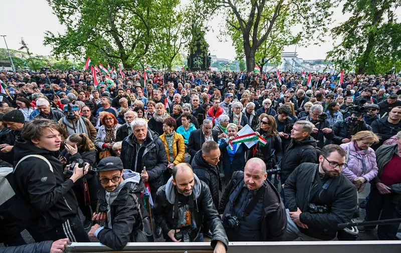 People attend a rally where Peter Magyar, Hungarian opposition figure, is to speak during the demonstration against the child protection policy of the Hungarian government in front of the Interior Ministry in Budapest on April 26, 2024. (Photo by ATTILA KISBENEDEK / AFP)