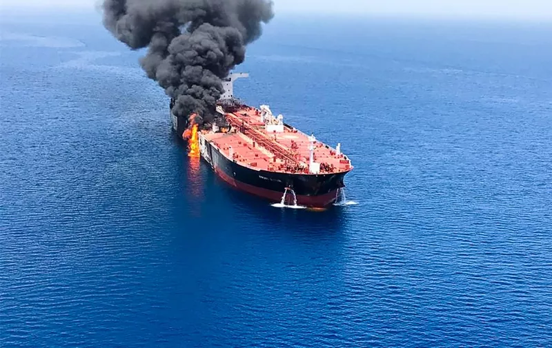 A picture obtained by AFP from Iranian News Agency ISNA on June 13, 2019 reportedly shows fire and smoke billowing from Norwegian owned Front Altair tanker said to have been attacked in the waters of the Gulf of Oman. - Suspected attacks left two tankers in flames in the waters of the Gulf of Oman today, sending world oil prices soaring as Iran helped rescue stricken crew members. The mystery incident, the second involving shipping in the strategic sea lane in only a few weeks, came amid spiralling tensions between Tehran and Washington, which has pointed the finger at Iran over earlier tanker attacks in May. (Photo by - / ISNA / AFP)