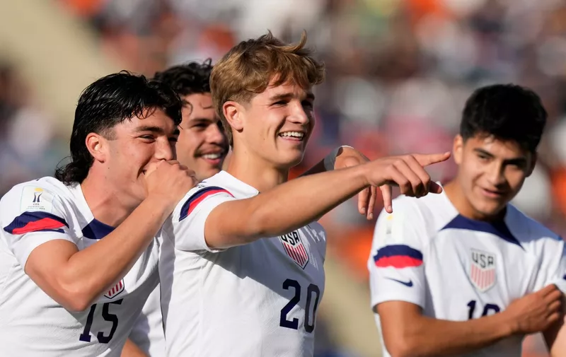 Rokas Pukstas (20) of the United States is congratulated after scoring his side's 4th goal against New Zealand during a FIFA U-20 World Cup round of 16 soccer match at the Malvinas Argentinas stadium in Mendoza, Argentina, Tuesday, May 30, 2023. (AP Photo/Natacha Pisarenko)