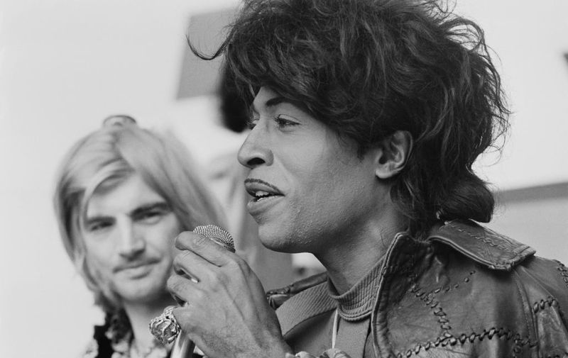 American musician and singer Little Richard pictured, with Screaming Lord Sutch behind,  speaking at a press conference to promote his appearance at the London Rock and Roll Show at Wembley Stadium in London, 4th August 1972. (Photo by Jack Kay/Daily Express/Hulton Archive/Getty Images)