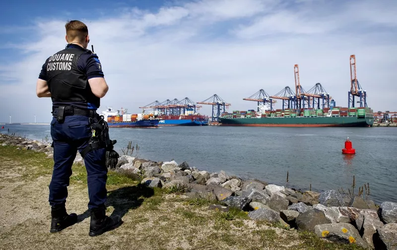 ROTTERDAM - A customs officer of the Port of Rotterdam Customs supervises the Maasvlakte. ANP KOEN VAN WEEL netherlands out - belgium out (Photo by Koen van Weel / ANP MAG / ANP via AFP)