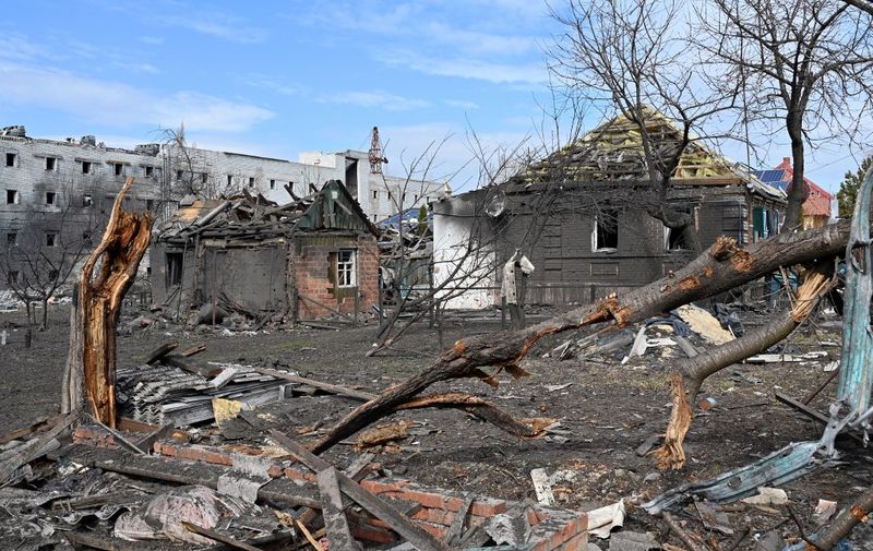 A photograph shows destroyed buildings in Kharkiv on March 29, 2022, destroyed by Russian troops shelling, on the 34th day of the Russian invasion of Ukraine. - Ukraine is calling for an "international agreement" to guarantee its security, which would be signed by several guarantor countries, said on March 29, 2022 the Ukrainian chief negotiator after several hours of Russian-Ukrainian talks in Istanbul. (Photo by Sergey BOBOK / AFP)
