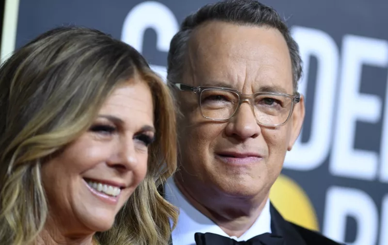 (FILES) In this file photo US actor Tom Hanks and wife Rita Wilson arrive for the 77th annual Golden Globe Awards on January 5, 2020, at The Beverly Hilton hotel in Beverly Hills, California. - Tom Hanks and his wife Rita Wilson have both tested positive for coronavirus, the US actor said Wednesday. Hanks, 63, said he and Wilson came down with a fever while in Australia, and will now be isolated and monitored. (Photo by VALERIE MACON / AFP)