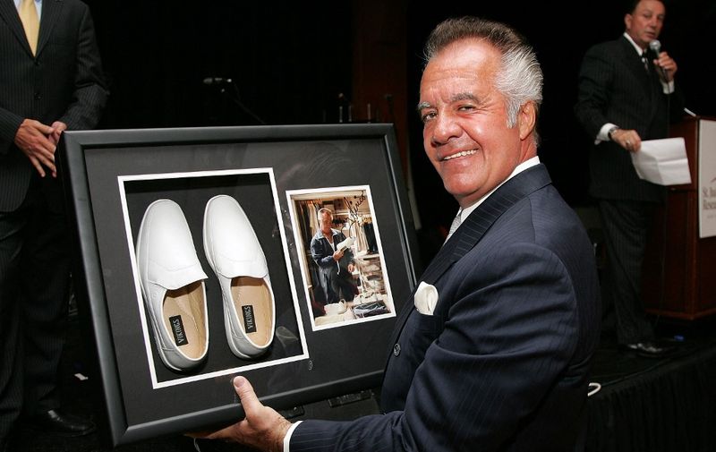 NEW YORK - JUNE 14:  Actor Tony Sirico holds the shoes he wore on the television show "The Sopranos", which are up for auction at the St. Jude's Children's Research Hospital Benefit at Pier 60 June 14, 2007 in New York City.  (Photo by Bryan Bedder/Getty Images) *** Local Caption *** Tony Sirico (Photo by Bryan Bedder / Getty Images North America / Getty Images via AFP)