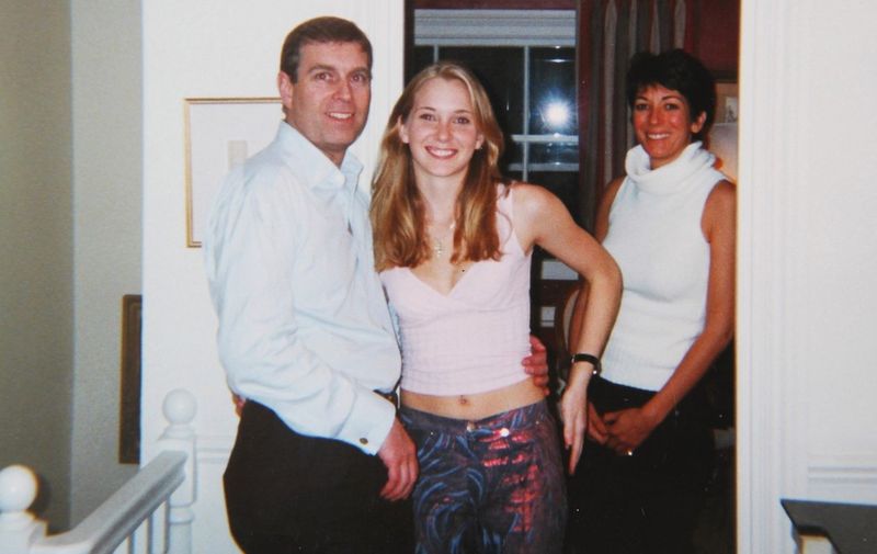 Los Angeles, CA  - **FILE PHOTOS** Prince Andrew smiling as he stands with his left arm around the waist of a young Virginia Roberts. It is alleged to have been taken in early 2001.  Ghislaine Maxwell stands behind.
*Editorial Use Only* see Special Instructions.

BACKGRID USA 17 NOVEMBER 2019,Image: 483417216, License: Rights-managed, Restrictions: , Model Release: no