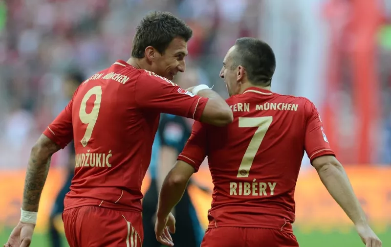 Bayern Munich's Croatian striker Mario Mandzukic (L) and Bayern Munich's French midfielder Franck Ribery celebrate after the second goal during the German first division Bundesliga match between Bayern Munich and TSG 1899 Hoffenheim in Munich, southern Germany, on October 6, 2012. AFP PHOTO/CHRISTOF STACHE

DFL RULES TO LIMIT THE ONLINE USAGE DURING MATCH TIME TO 15 PICTURES PER MATCH. IMAGE SEQUENCES TO SIMULATE VIDEO IS NOT ALLOWED AT ANY TIME. FOR FURTHER QUERIES PLEASE CONTACT THE DFL DIRECTLY AT + 49 69 650050. (Photo by CHRISTOF STACHE / AFP)
