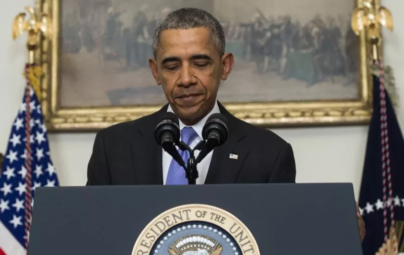 US President Barack Obama speaks about US - Iranian relations, including the Iranian-American nationals that were jailed in Iran and are being freed as part of a prisoner swap, in the Cabinet Room of the White House in Washington, DC, January 17, 2016. 
The presidential statement comes after the lifting of international sanctions against Iran as part of a nuclear deal capped by a US-Iranian prisoner exchange. / AFP / SAUL LOEB