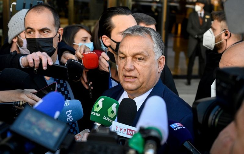 Hungarian Prime Minister Viktor Orban talks to the press on the sidelines of the "Defend Europe" summit, organised by the Spanish far-right party VOX, in Madrid on January 29, 2022. - A dozen far-right and conservative sovereigntist leaders meet in Madrid for a new summit intended to make progress on forming a joint group in the European Parliament. (Photo by OSCAR DEL POZO / AFP)