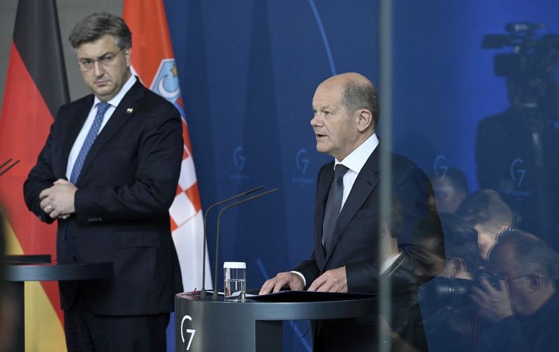 German Chancellor Olaf Scholz (R) speaks as Croatian Prime Minister Andrej Plenkovic listens during a joint press conference after talks at the Chancellery in Berlin on June 1, 2022. (Photo by John MACDOUGALL / AFP)