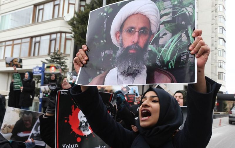 Iranian and Turkish demonstrators hold pictures of Shiite cleric Sheikh Nimr al-Nimr as they protest outside the Saudi Embassy in Ankara, on January 3, 2016, to protest against the execution by Saudi Arabia of a prominent Shiite cleric which they saw as a deliberate sectarian aggression.
Nimr and other Shiite activists were among a total of 47 people executed, most of them described by the interior ministry as involved in killings by Al-Qaeda.
 / AFP / ADEM ALTAN