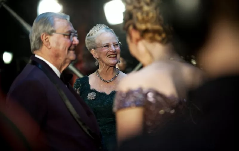 Danish Queen Margrethe (C) and her husband Prince Henrik (L) thank artists late on January 14, 2012 after a gala performance at the Royal Concert Hall in Copenhagen to mark her 40 years on the throne.  AFP PHOTO / MARIE HALD / AFP PHOTO / SCANPIX DENMARK / MARIE HALD