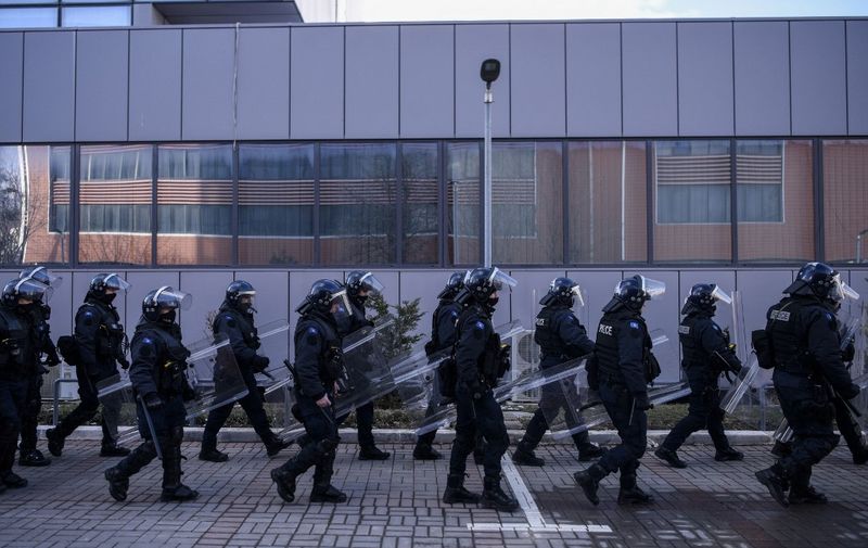 Kosovo police secure the government headquarters in Pristina on January 29, 2022 during a protest against the increase of electricity prices in Kosovo. (Photo by Armend NIMANI / AFP)