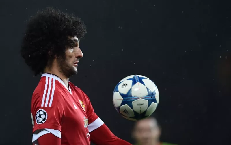 Manchester United's Belgian midfielder Marouane Fellaini eyes the ball during a UEFA Chamions league group stage football match between CSKA Moscow and Manchester United at Old Trafford in Manchester, north west England on November 3, 2015. AFP PHOTO/PAUL ELLIS / AFP / PAUL ELLIS