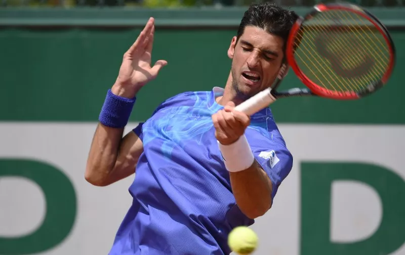 Brazil's Thomaz Bellucci returns the ball to Australia's Marinko Matosevic during the men's first round at the Roland Garros 2015 French Tennis Open in Paris on May 25, 2015. AFP PHOTO / PASCAL GUYOT
