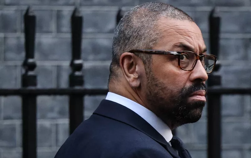 Britain's Home Secretary James Cleverly leaves from 10 Downing Street in central London on December 12, 2023, after attending a cabinet meeting. (Photo by Adrian DENNIS / AFP)