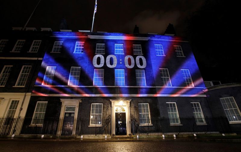 A digital Brexit countdown clock shows 00:00 as the time reaches 11 o'clock, as it is projected onto the front of 10 Downing Street, the official residence of Britain's Prime Minister, in central London on January 31, 2020, as Britain prepares to leave the European Union at 2300GMT. - Brexit supporters gathered outside parliament on Friday to cheer Britain's departure from the European Union following three years of epic political drama -- but for others there were only tears. After 47 years in the European fold, the country leaves the EU at 11:00pm (2300 GMT) on Friday, with a handful of the most enthusiastic supporters gathering opposite the Houses of Parliament 12 hours before the final countdown. (Photo by Tolga AKMEN / AFP)