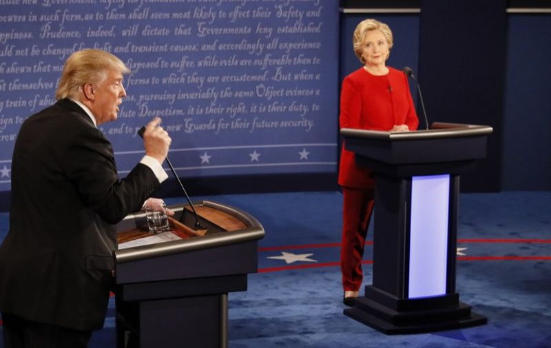 Democratic nominee Hillary Clinton (R) exchanges with Republican nominee Donald Trump (L) during the first presidential debate at Hofstra University in Hempstead, New York on September 26, 2016.
Hillary Clinton and Donald Trump face off in one of the most consequential presidential debates in modern US history with up to 100 million viewers set to tune in. / AFP PHOTO / POOL / RICK WILKING