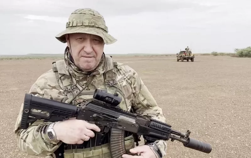 UNSPECIFIED LOCATION IN AFRICA - AUGUST 21: (----EDITORIAL USE ONLY - MANDATORY CREDIT - 'WAGNER TELEGRAM ACCOUNT / HANDOUT' - NO MARKETING NO ADVERTISING CAMPAIGNS - DISTRIBUTED AS A SERVICE TO CLIENTS----) A screen grab captured from a video shared online shows Yevgeny Prigozhin, the founder of the Russian private security company Wagner, holding a rifle in a desert area while wearing camouflage in a video for the first time after his rebellion against the Russian administration in an unspecified location in Africa on August 21, 2023. In the footage shared on the Telegram channel 'Wagner's evacuation', Prigozhin stated that they have made Russia 'even greater' on all continents, including Africa. Wagner Account / Anadolu Agency (Photo by Wagner Account / ANADOLU AGENCY / Anadolu Agency via AFP)