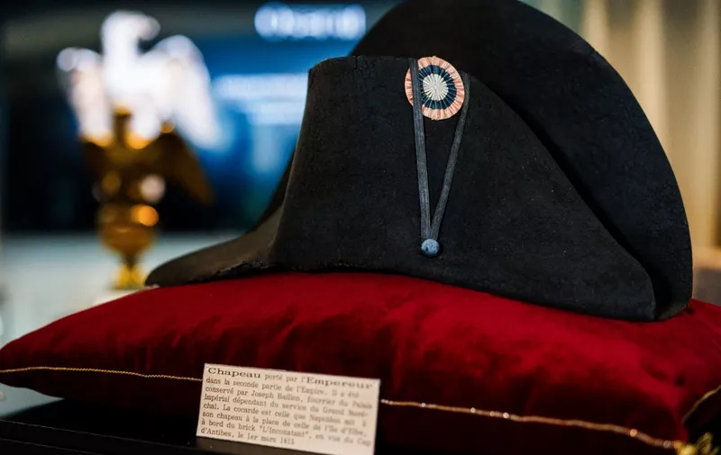 (FILES) A black bicorne hat with red, white and blue cockade worn by the French Emperor Napoleon I (1769-1821), from the Collection of Jean Louis Noisiez, is displayed before an auction sale at Osenat auction house in Paris on November 6, 2023. The second part of the auction of the Noisiez' collection, including the legendary hat of Emperor Napoleon, organised by auction house Osenat, will take place on November 19, 2023 in Fontainebleau, south of Paris. (Photo by Dimitar DILKOFF / AFP)