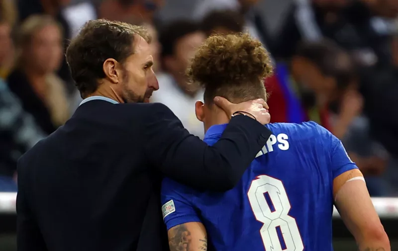 Soccer Football - UEFA Nations League - Group C - Germany v England - Allianz Arena, Munich, Germany - June 7, 2022 England's Kalvin Phillips with manager Gareth Southgate after being substituted due to injury REUTERS/Kai Pfaffenbach