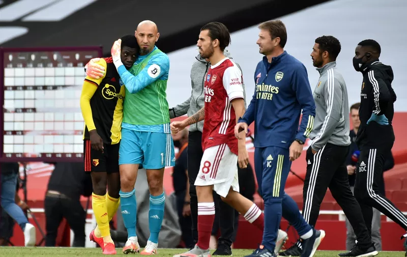 LONDON, ENGLAND - JULY 26: Heurelho Gomes and Ismaila Sarr both of Watford hug after the Premier League match between Arsenal FC and Watford FC at Emirates Stadium on July 26, 2020 in London, England. Football Stadiums around Europe remain empty due to the Coronavirus Pandemic as Government social distancing laws prohibit fans inside venues resulting in all fixtures being played behind closed doors. (Photo by Rui Vieira/Pool via Getty Images)