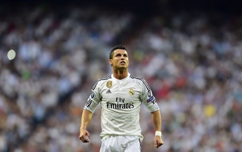 Real Madrid's Portuguese forward Cristiano Ronaldo reacts during the UEFA Champions League semi-final second leg football match Real Madrid FC vs Juventus at the Santiago Bernabeu stadium in Madrid on May 13, 2015.   AFP PHOTO/ GERARD JULIEN