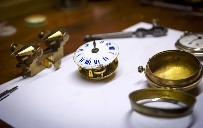 A picture taken on March 24, 2015 in Orleans, shows a close up of a watch named "coque oignon" that dates back to the Louis XIV era. This year, clocks will spring forward an hour to summer time on March 30, 2015. Daylight saving time was first introduced in 1973 with the oil crisis for the sake of saving energy and is applied today in more than 70 countries. AFP PHOTO / GUILLAUME SOUVANT (Photo by GUILLAUME SOUVANT / AFP)