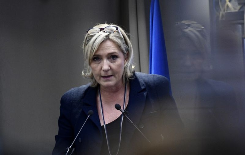 French far-right Front National (FN) party president, member of European Parliament and candidate for France's 2017 presidential election, Marine Le Pen delivers a speech during a meeting about healthcare, on December 9, 2016 in Paris.  / AFP PHOTO / MARTIN BUREAU