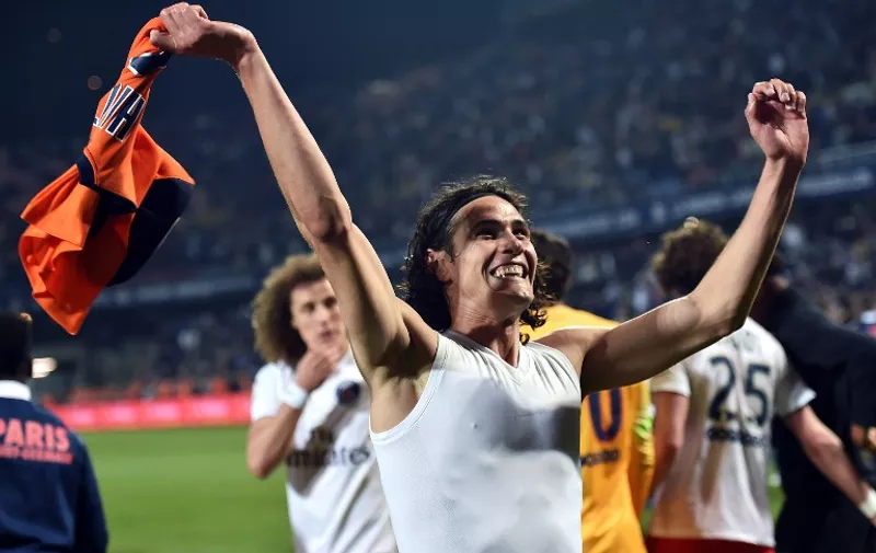 Paris Saint-Germain's Uruguayan forward Edinson Cavani  celebrates winning the French L1 football match between Montpellier (MHSC) and Paris Saint-Germain (PSG) on May 16, 2015 at La Mosson Stadium in Montpellier, southern France.  Paris Saint-Germain won their third consecutive French Championship title by winning the match.  