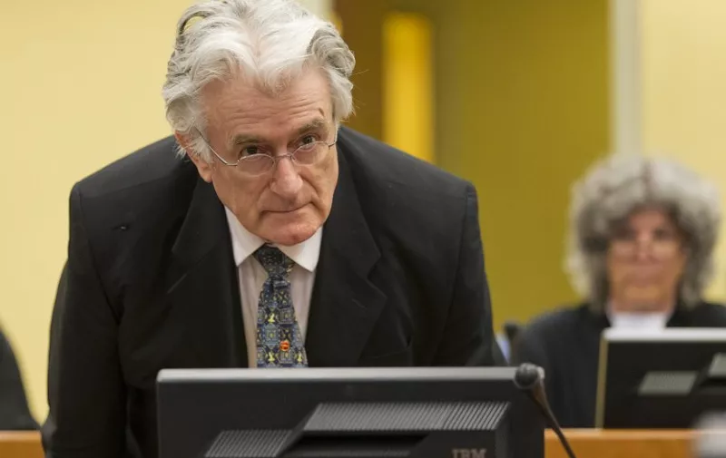 Bosnian Serb wartime leader Radovan Karadzic appears in the courtroom for his appeals judgement at the International Criminal Tribunal for Former Yugoslavia (ICTY) in The Hague, The Netherlands, on July 11 2013. AFP PHOTO/ POOL/MICHAEL KOOREN / AFP / POOL / MICHAEL KOOREN