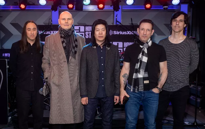 LOS ANGELES, CALIFORNIA - MARCH 28: (L-R) Jeff Schroeder, Billy Corgan, Jimmy Chamberlin, James Iha and Matt McJunkins of the Smashing Pumpkins visit SiriusXM's 'The Howard Stern Show' at SiriusXM Studios on March 28, 2023 in Los Angeles, California.   Emma McIntyre/Getty Images for SiriusXM/AFP (Photo by Emma McIntyre / GETTY IMAGES NORTH AMERICA / Getty Images via AFP)