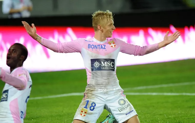 Evian's Danish midfielder Daniel Wass celebrates after scoring a goal during their French L1 football match Evian Thonon Gaillard against Metz (FC) on October 4, 2014 at the stadium Parc des Sport in Annecy, southern France. AFP PHOTO / JEAN-PIERRE CLATOT