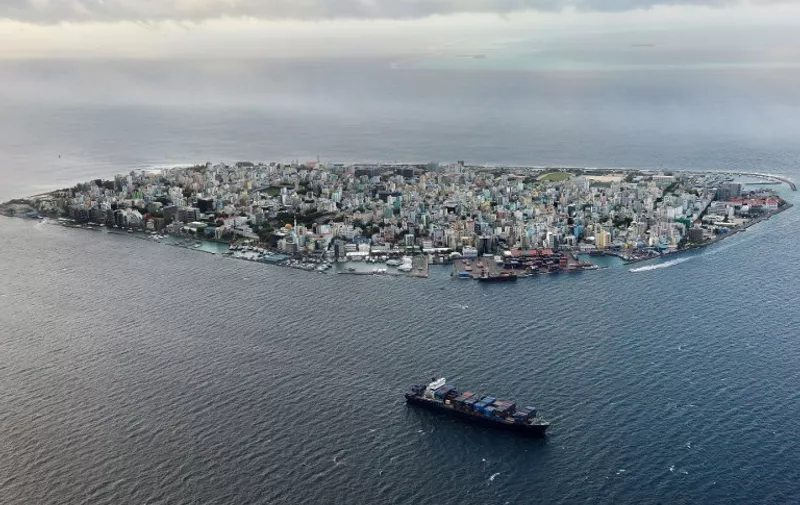 (FILES) This photograph taken on September 9, 2013, shows an aerial view of the island of Male, the capital of the Maldives.  Maldives President Abdulla Yameen declared a state of emergency on November 3, 2015, giving sweeping powers to security forces to arrest suspects ahead of a major anti-government protest rally, his spokesman said. The move came two days ahead of a planned protest by the main opposition Maldivian Democratic Party (MDP), whose leader Mohamed Nasheed is in jail after a widely criticised conviction under anti-terror laws.    AFP PHOTO/ Roberto SCHMIDT/FILES