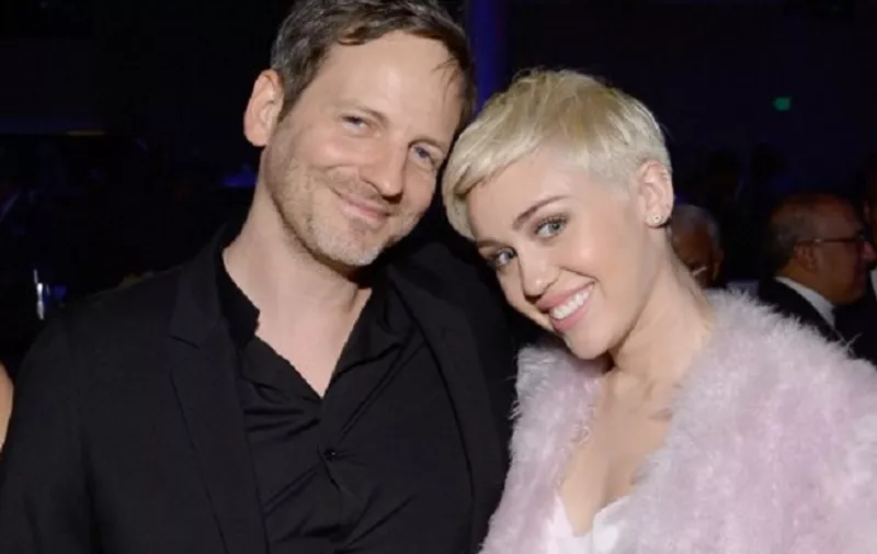 BEVERLY HILLS, CA - JANUARY 25: Producer Dr. Luke (L) and recording artist Miley Cyrus attend the 56th annual GRAMMY Awards Pre-GRAMMY Gala and Salute to Industry Icons honoring Lucian Grainge at The Beverly Hilton on January 25, 2014 in Beverly Hills, California.   Larry Busacca/Getty Images for NARAS/AFP
