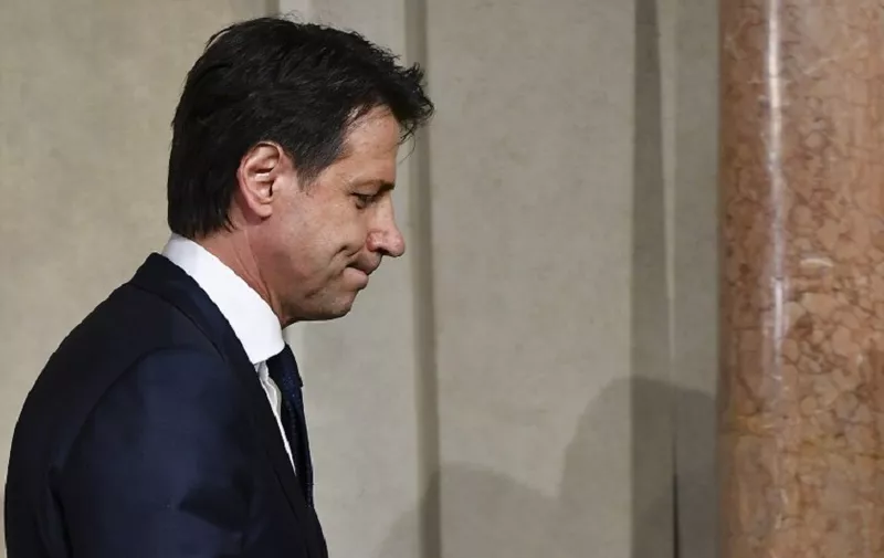 Italy's Prime minister candidate Giuseppe Conte leaves after a meeting with Italy's President Sergio Mattarella on May 27, 2018 at the Quirinale presidential palace in Rome. Italy's prime ministerial candidate Giuseppe Conte gave up on Sunday his mandate to form a government after talks with the president over his cabinet collapsed. / AFP PHOTO / Vincenzo PINTO
