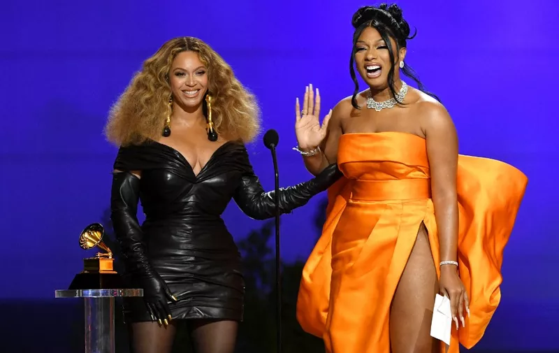 LOS ANGELES, CALIFORNIA - MARCH 14: (L-R) Beyoncé and Megan Thee Stallion accept the Best Rap Performance award for 'Savage' onstage during the 63rd Annual GRAMMY Awards at Los Angeles Convention Center on March 14, 2021 in Los Angeles, California.   Kevin Winter/Getty Images for The Recording Academy/AFP (Photo by KEVIN WINTER / GETTY IMAGES NORTH AMERICA / Getty Images via AFP)