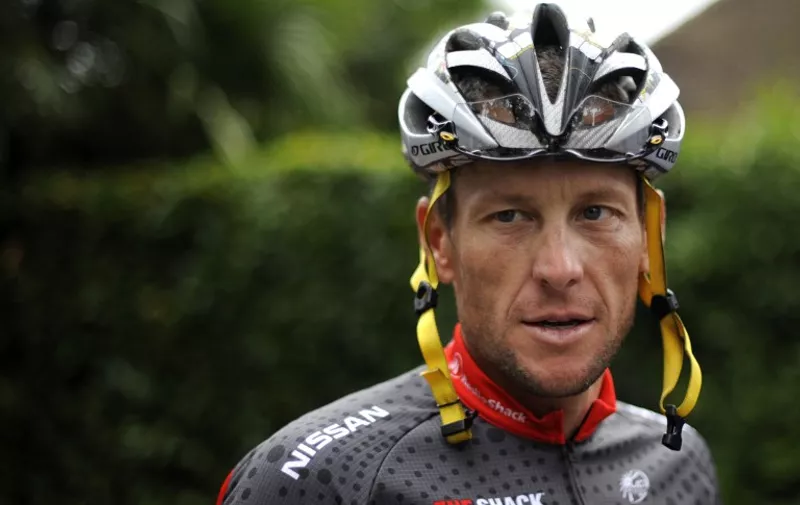 (FILES) TO GO WITH AFP STORY BY IAN WHITTELL
A file photo taken on July 21, 2010 shows US cyclist Lance Armstrong as he arrives to participate in a training session during the second of the two rest days of the 2010 Tour de France cycling race at the hotel hosting the US cycling team in Pau, south west France.  AFP PHOTO / NATHALIE MAGNIEZ